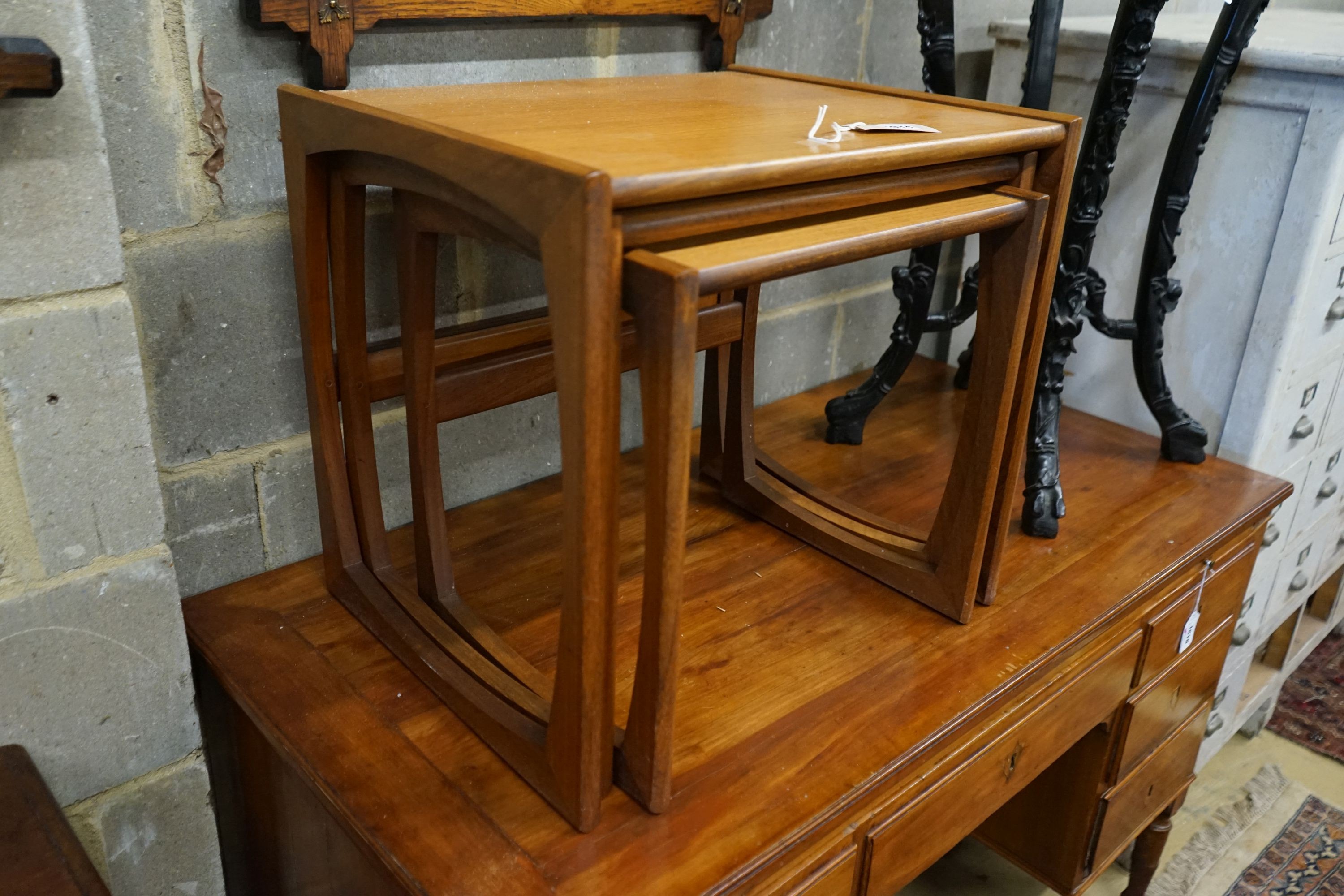 A nest of three rectangular G Plan teak tea tables, width 53cm, depth 43cm, height 48cm